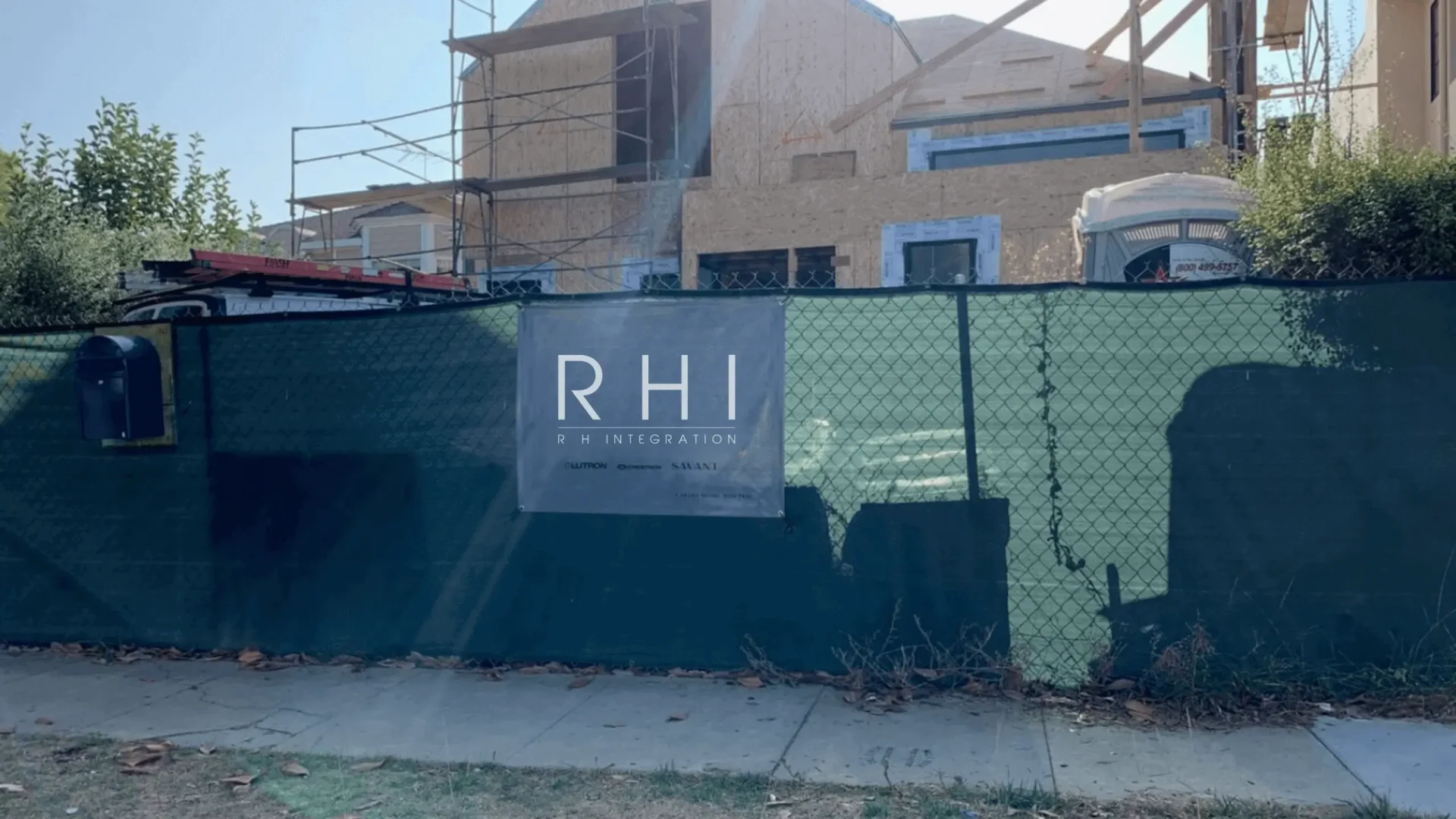 Construction site with RHI sign on fence.