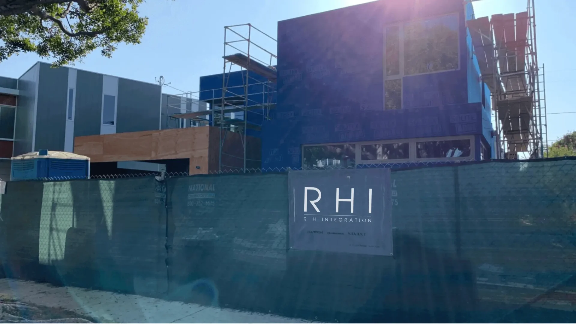 Building under construction with RHI sign.