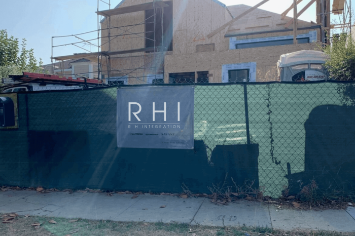 Construction site with RHI sign on fence.