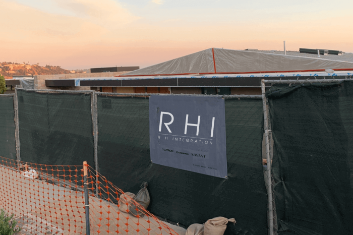 Construction site with RHI banner at sunset.